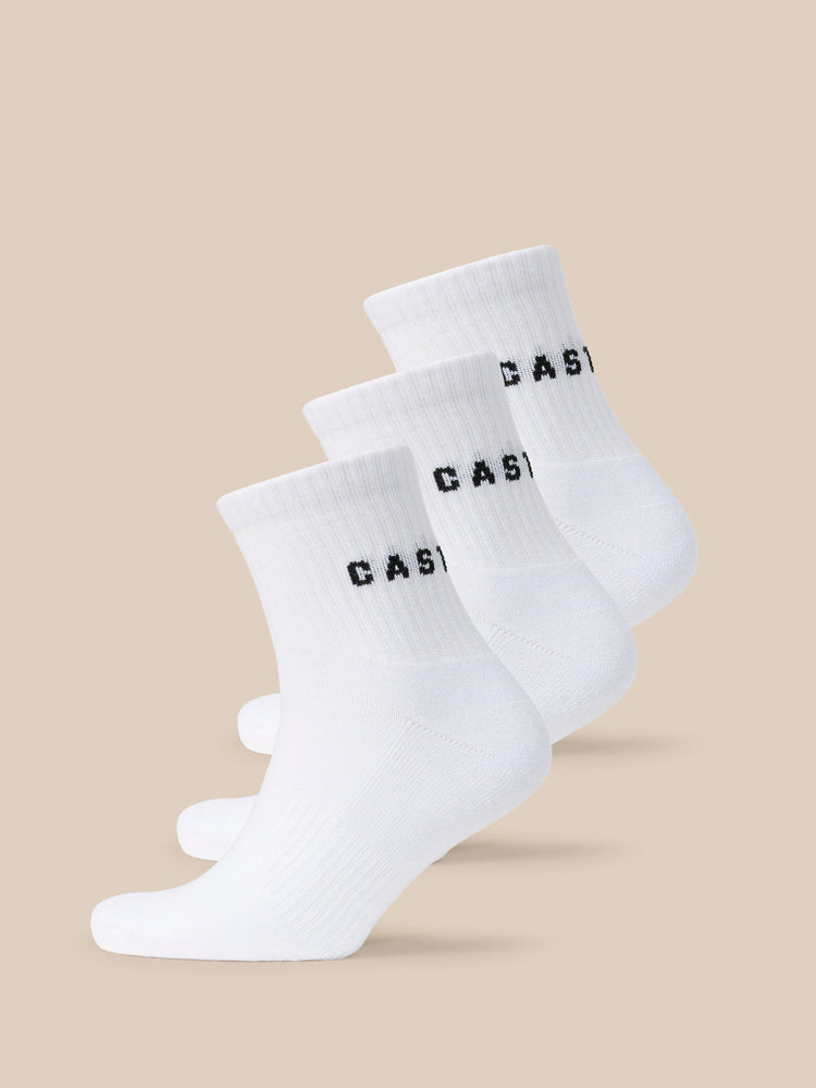 Three white quarter socks with black CASTORE logo across the cuff