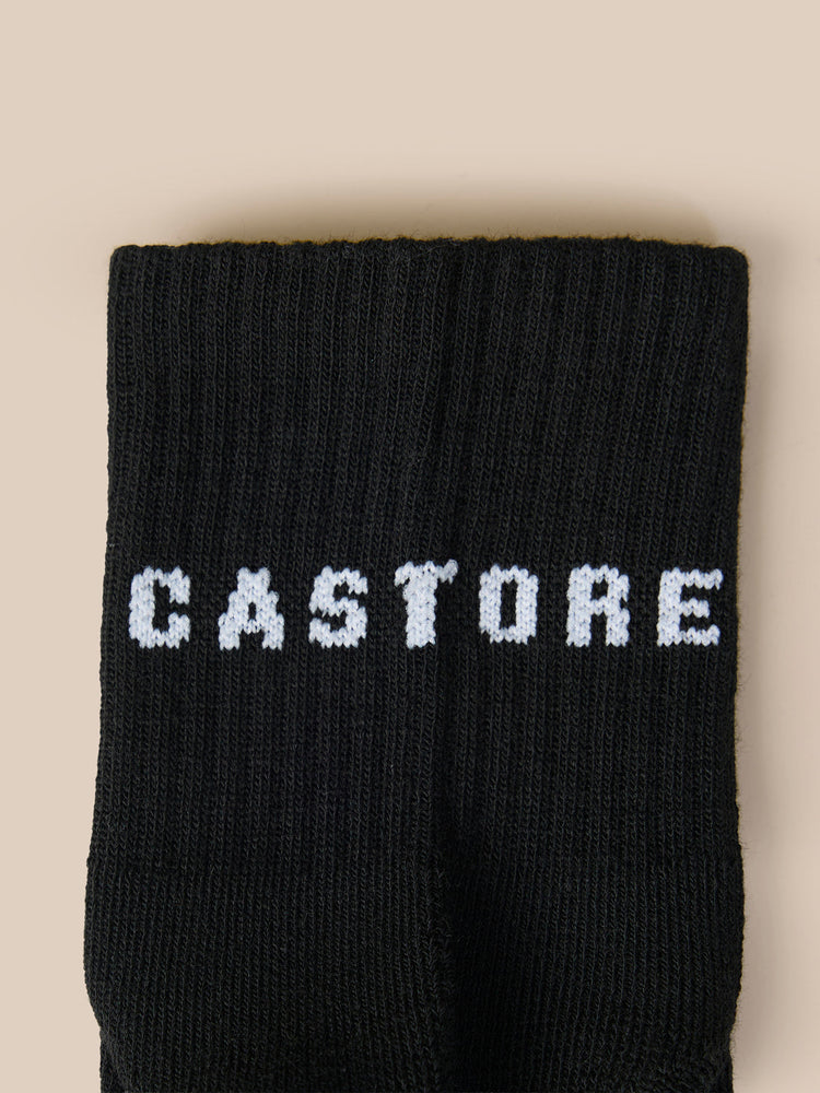 Close-up of three black quarter socks showing the CASTORE logo on the cuff