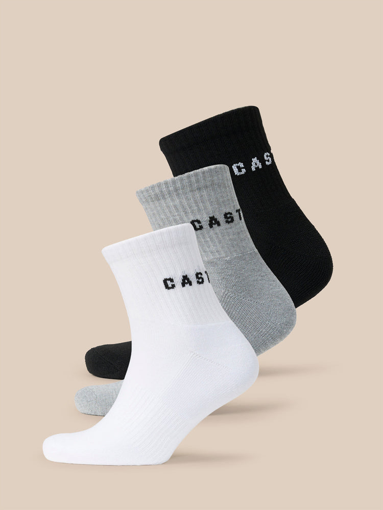 Three pack of Castore X Druce quarter socks in white grey and black with CASTORE branding.