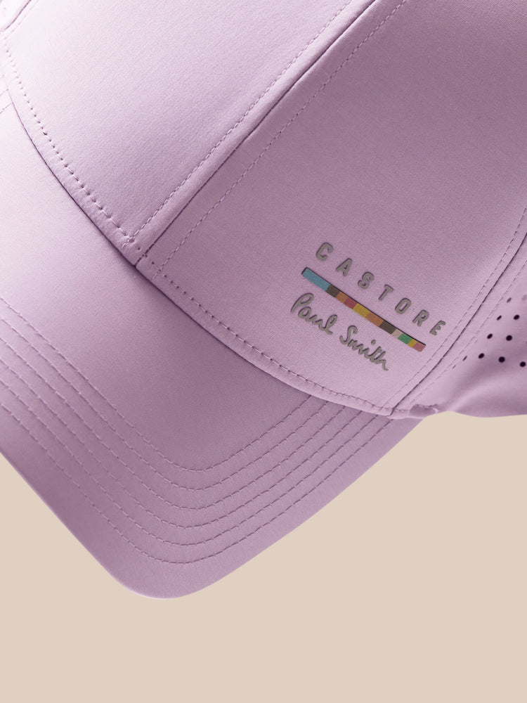 Lavender baseball cap with brand logo on a beige background