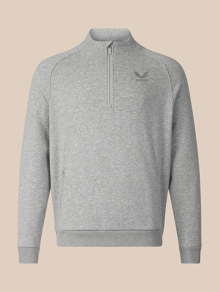 A light gray heathered quarter-zip sweatshirt with a small dark gray embroidered logo on the left chest, displayed on a solid beige background.
