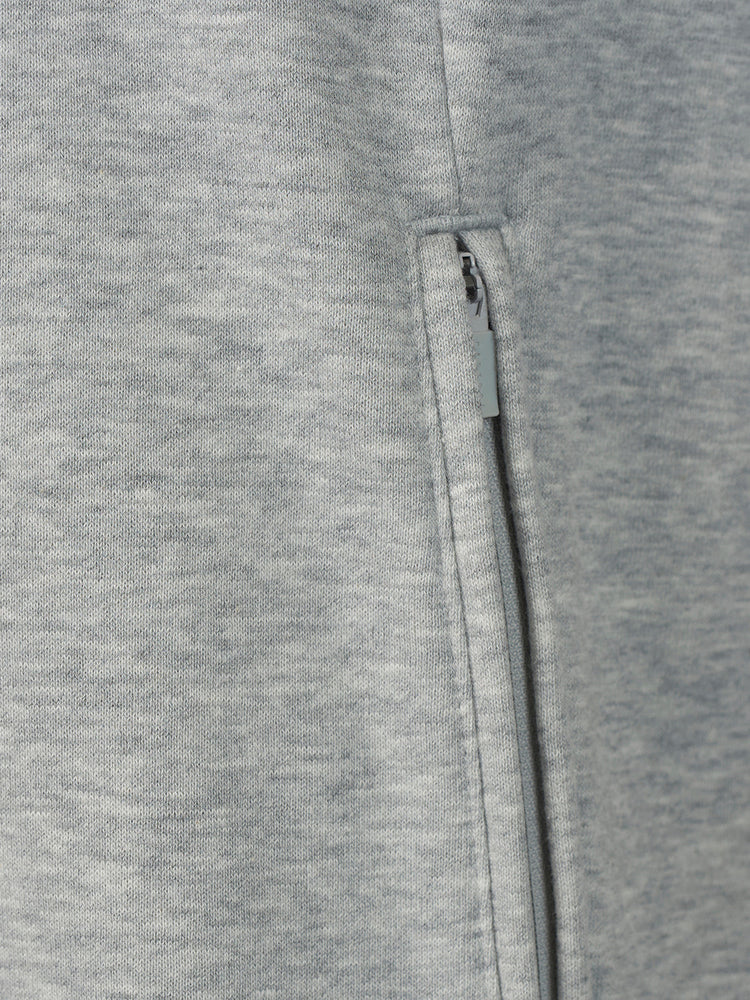 Close-up of a heather gray fabric garment showing a vertical zipper detail.