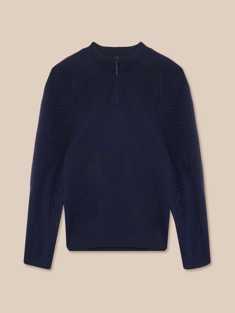 Navy blue long-sleeve shirt on a beige background