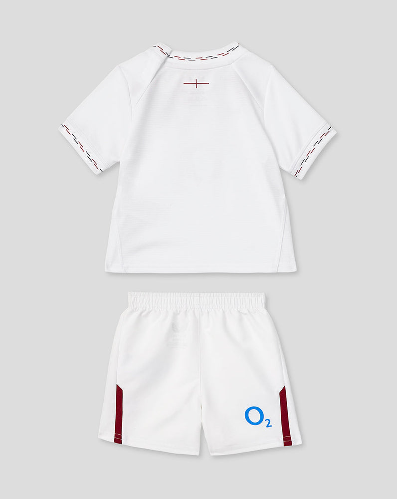 White sports outfit with maroon accents on a light gray background