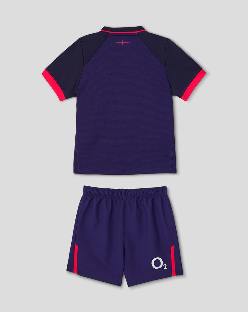 Navy sports outfit with red accents on a light gray background
