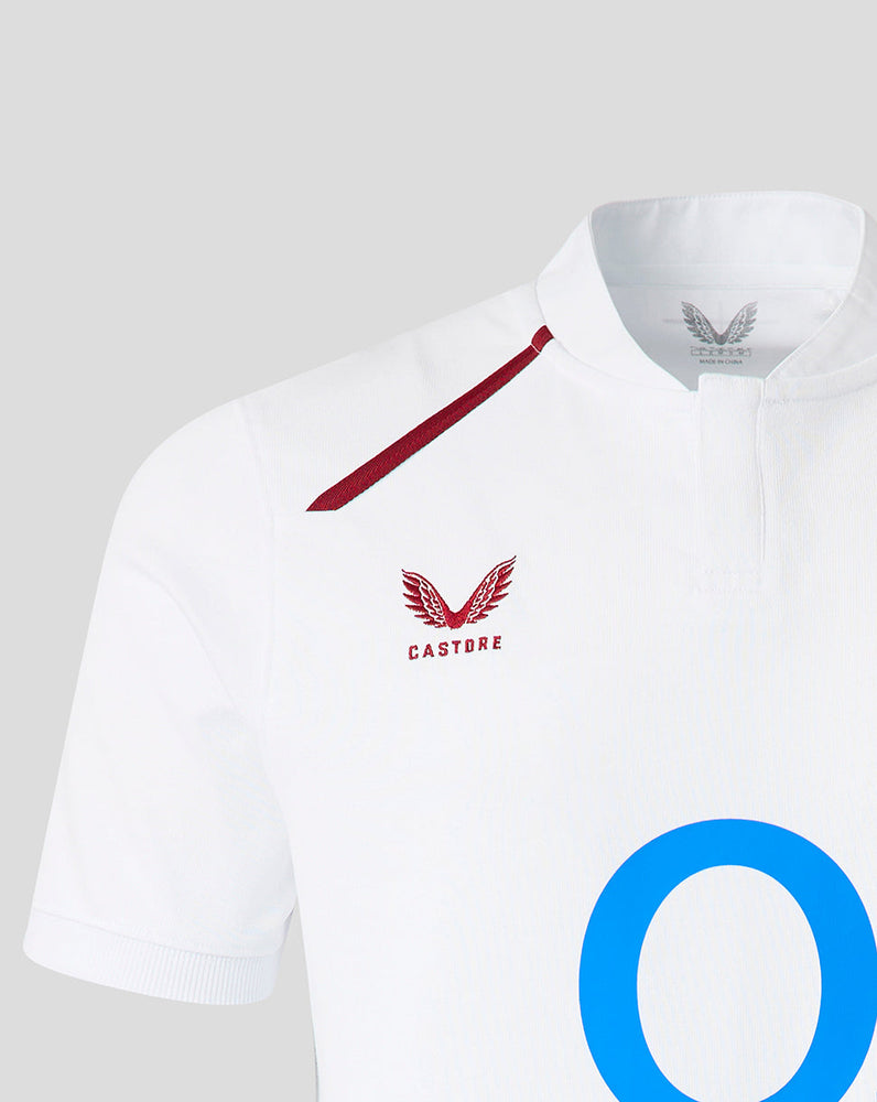 White polo shirt with red accents and a visible brand logo on a gray background