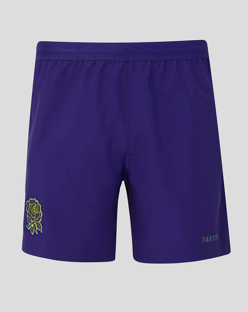 Purple shorts with a green logo on a gray background