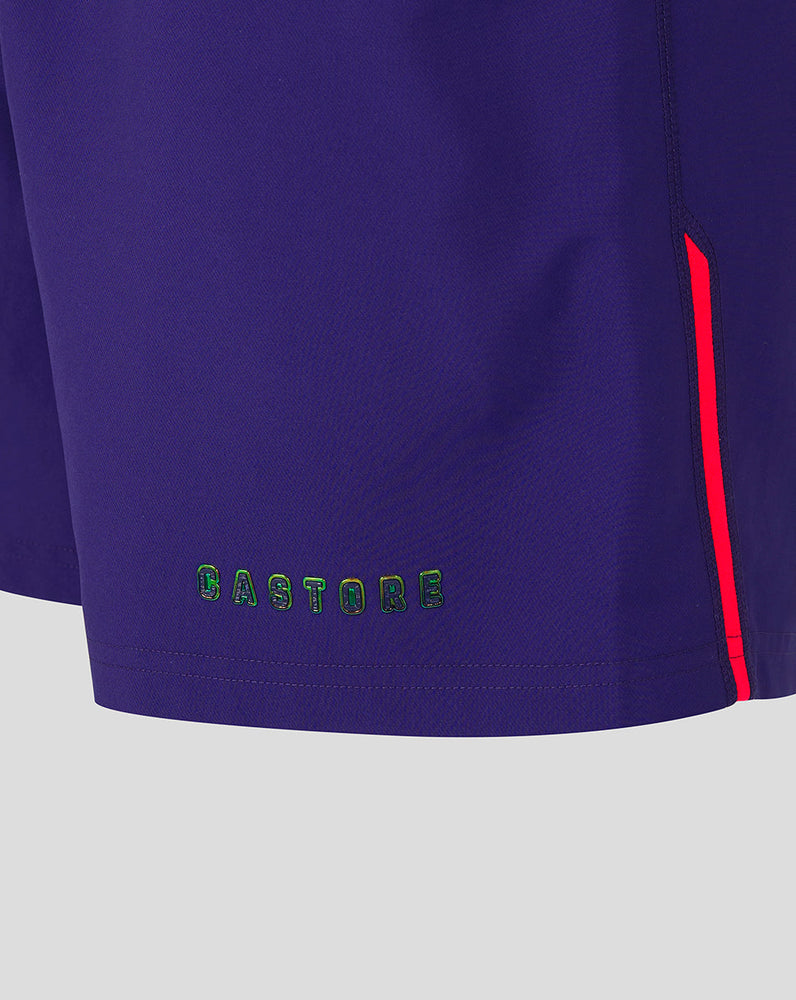 Navy shorts with a red stripe and 'CASTORE' branding on a light gray background