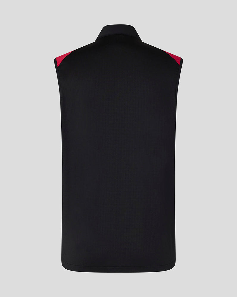 Black vest with red accents on a gray background