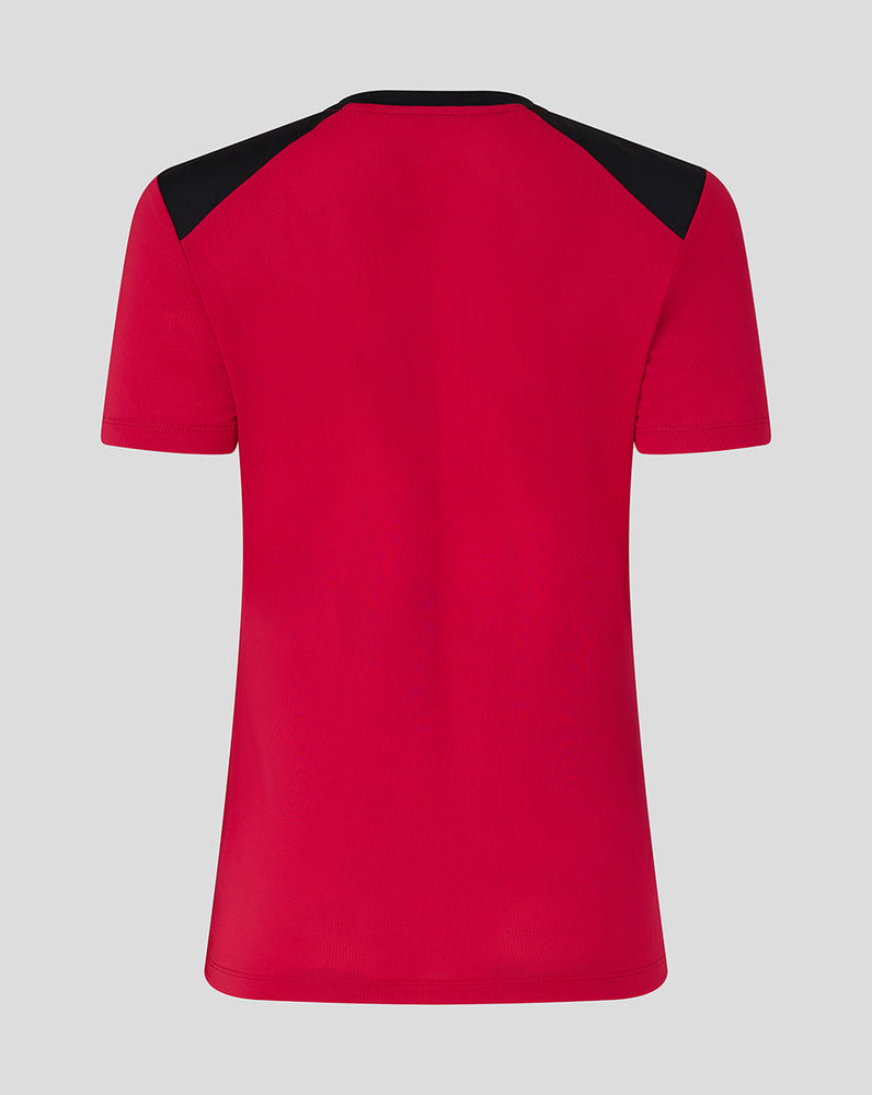 Red t-shirt with black sleeves on a gray background