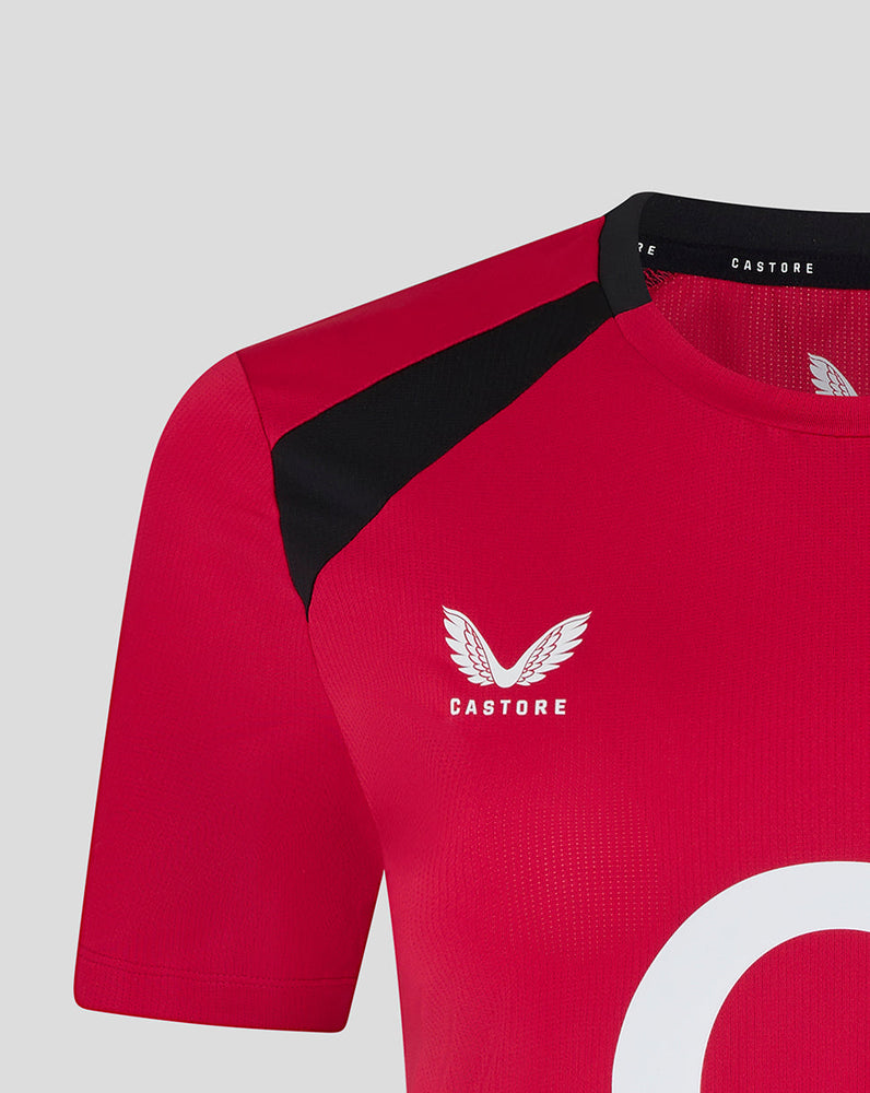 Red sports jersey with black sleeves and 'Castore' logo on a light gray background