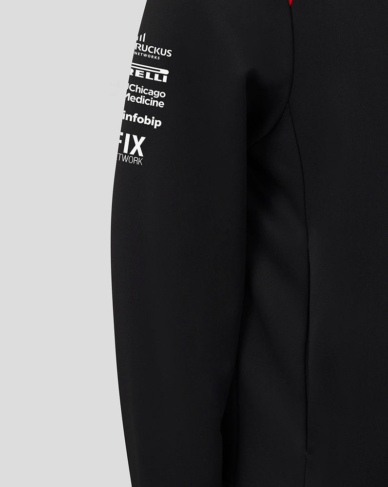 Black jacket with white text logos on a gray background