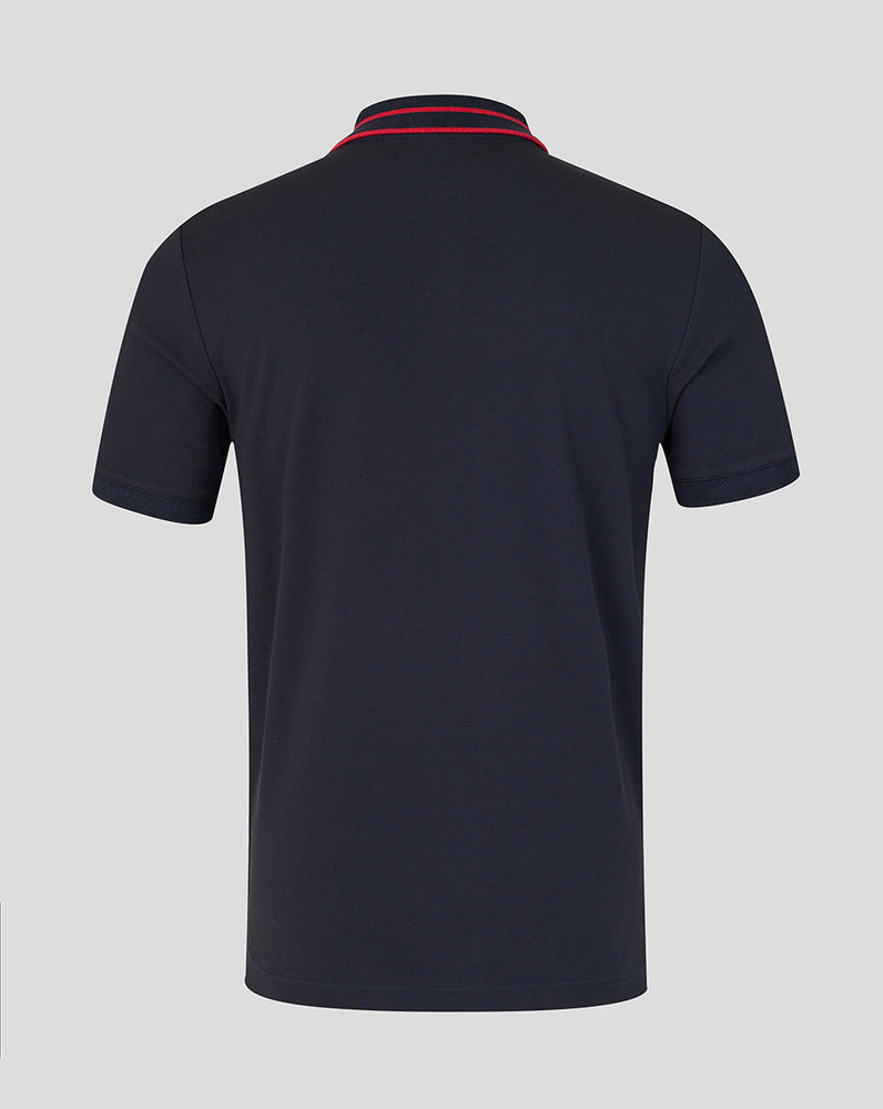 Black polo shirt with red and blue trim on a gray background